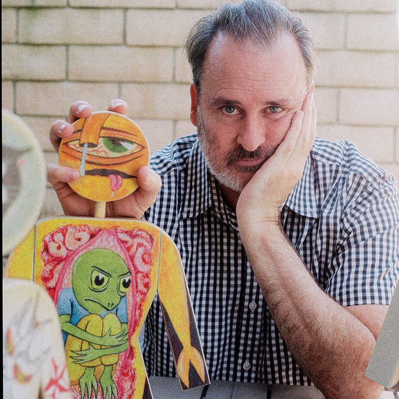 Ed looking very happy with a Girl doll in his hands